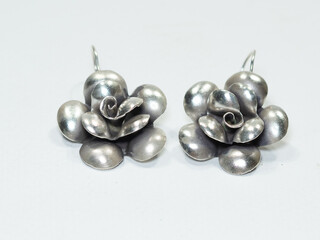 Silver jewelry and gemstone on white background