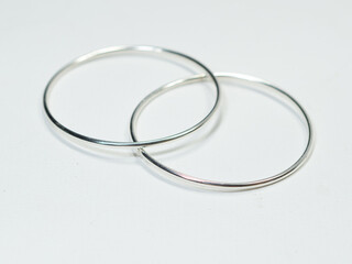 Silver jewelry and gemstone on white background
