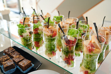 mini salads in plastic cups, aperitif salad