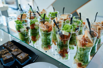 mini salads in plastic cups, aperitif salad
