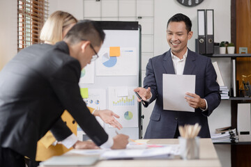 Technology and financial advisory services concert. Business teamwork and working on digital laptop computer with advisor showing plan of investment to clients at table office. Digital marketing.
