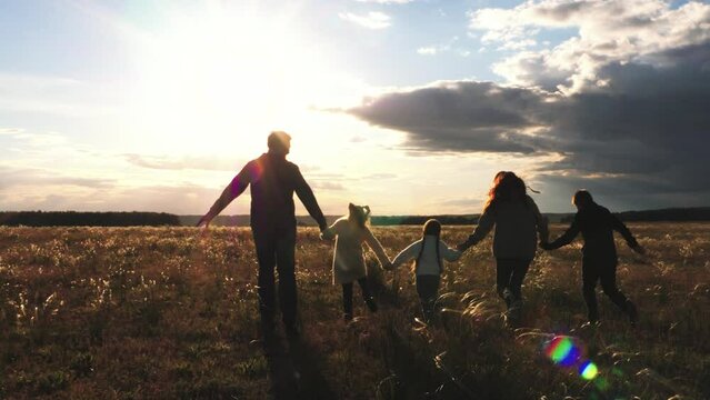 child mother father, big happy family run sunset, take hand, run group team, children game, superhero plane pilot, against backdrop sunset sky, big happy family, achievement, carefree childhood