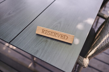 The sign on the table is reserved, the information plate