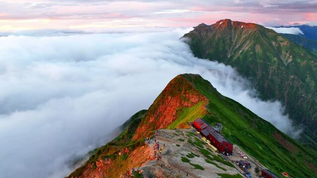 Aerial view of beautiful foggy morning in Japanese Alps, hiking in Japan, establishing shot of epic morning in the mountains