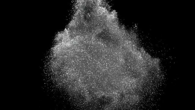 Colorful powder, GlitterPowder exploding against black background. Shot with high speed camera, Slow Motion,Super slow motion of coloured powder collision isolated on black background. Glitter