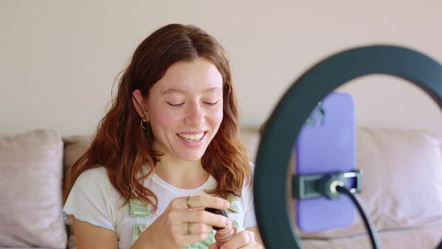 Gen Z influencer guiding makeup tutorial with ring light assistance