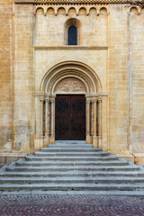 Fototapeta na wymiar Long flight of steps leading to an arched door