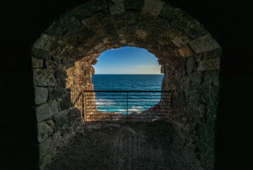 Ancient railroad tunnel and seascape, used as a bicycle and pedestrian path. The road connects the three villages of Levanto, Bonassola and Framura, Liguria, Italy, Europe.