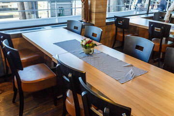 Long wooden dining table in a restaurant
