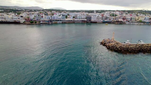 Left to right pan shot of Hersonissos city and the port. Crete, Greece.