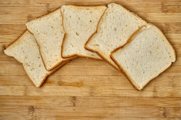 Organic toast bread on a wooden surface