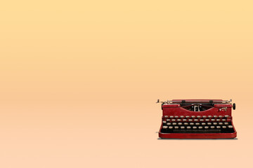 Vintage typewriter on orange gradient background