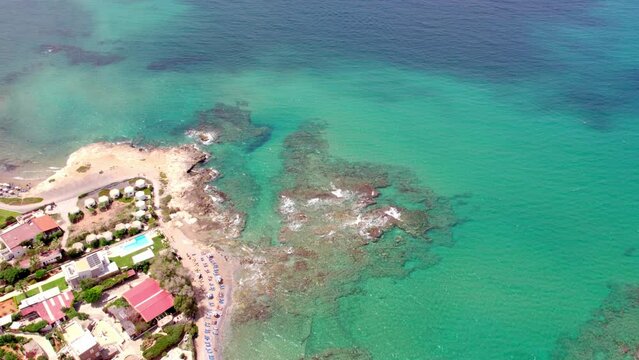 Still and slow motion aerial view of a beach in Hersonissos, on the Greek island of Crete.