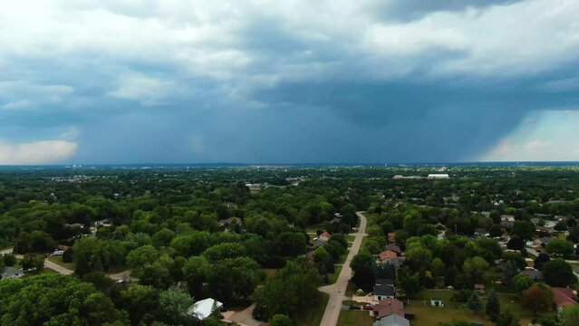 aerial moving toward the downpour of rainfall over Appleton, Wisconsin