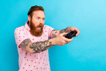 Profile portrait of impressed speechless person hold controller play video games look empty space isolated on blue color background - Powered by Adobe