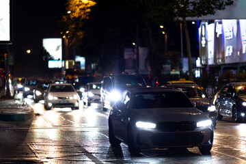 Car driving on night city street