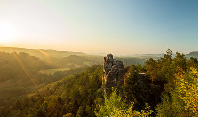 the sun rises at the elbsandsteingebirge