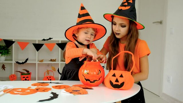 Halloween holiday child and pumpkin. Selective focus.