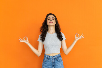 Relaxed woman meditating on bright background, yoga techniques, concentration - obrazy, fototapety, plakaty
