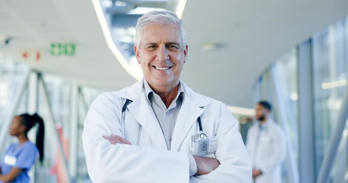 Doctor pride, face and a man with arms crossed for healthcare, emergency service or nursing. Happy, hospital and portrait of a mature surgeon or clinic worker with confidence in medical career