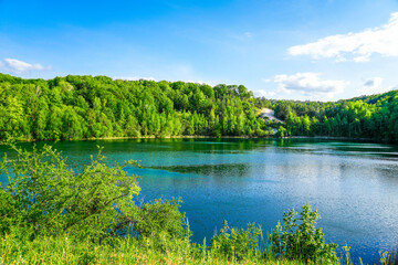Jezioro Turkusowe near Wapnica. Lake in Wolin National Park in Poland. Idyllic landscape with green nature by the lake. Turquoise lake.   © Elly Miller