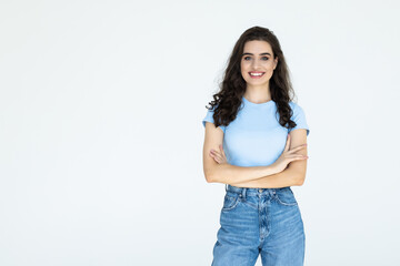 Confident woman with arms crossed over a white background