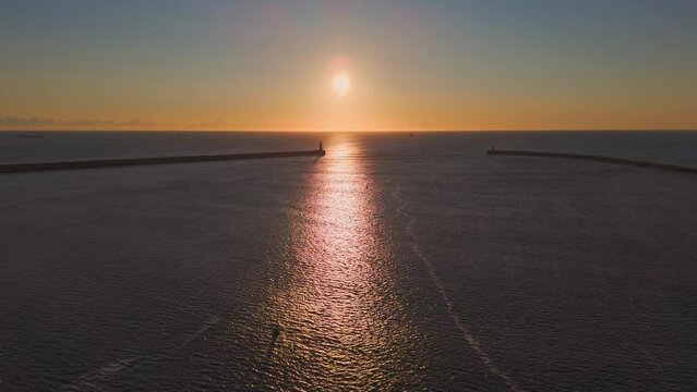 Flying out of Tynemouth Harbour towards a rising Sun during Golden Hour