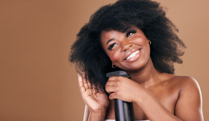Thinking, hair and spray with a model black woman in studio on a brown background for natural cosmetics. Face, smile and haircare with a happy afro female person indoor for dry shampoo treatment