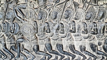 Wall carving of Khmer Culture in Ancient ruins Angkor Wat temple - famous Cambodian landmark. Siem Reap, Cambodia.