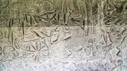 Wall carving of Khmer Culture in Ancient ruins Angkor Wat temple - famous Cambodian landmark. Siem Reap, Cambodia.