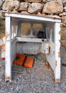 Wreckage of a fishing boat yf on the beach of Greece