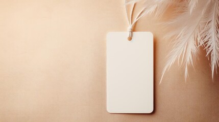 Close-Up of white blank tag with a rope for mockup on cream color background