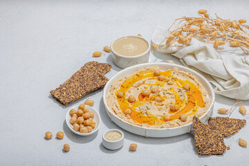 Hummus with olive oil, crispy bread. Indispensable for healthy lifestyle. Comfort food, vegan snack