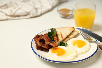 Tasty breakfast and delicious meat food concept - fried bacon