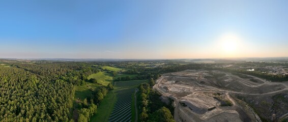An aerial panorama of countryside in Dorset showing the contrast between a forested area and area...