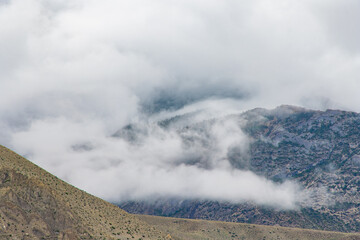 Green Foggy Mountain Landscape of the HImalayas in Kagbeni of Upper Mustang, Nepal