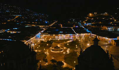 Aerial view the Historic Colonial Buildings on the Plaza de Armas Square with Many Visitors at Night, Cusco, Peru, South America, - obrazy, fototapety, plakaty