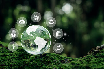 ESG concept.Crystal earth on moss with nature background.ESG icon for Environment Social and...