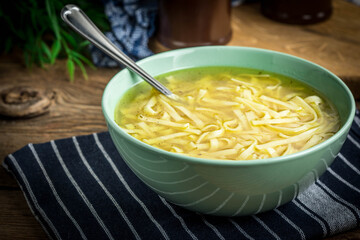 Broth - chicken soup in a bowl.