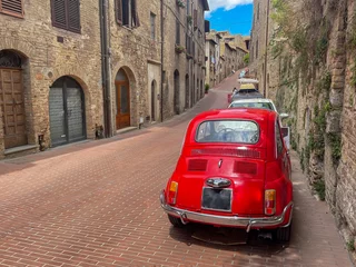 Fotobehang red vintage car in the italy street © Animaflora PicsStock