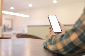 cell phone blank white screen mockup.hand holding texting using mobile on desk at office.background empty space for advertise.work people contact marketing business,technology