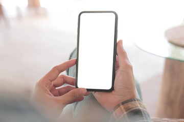 cell phone blank white screen mockup.hand holding texting using mobile on desk at office.background empty space for advertise.work people contact marketing business,technology