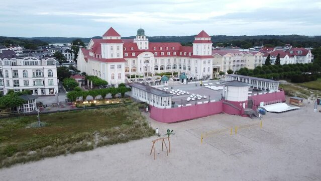 Aerial drone view - Beach in the Baltic resort of Binz shortly after sunrise, on the horizon the Kurhaus Binz, pier, Ruegen Island, Mecklenburg-Western Pomerania, Germany, Europe