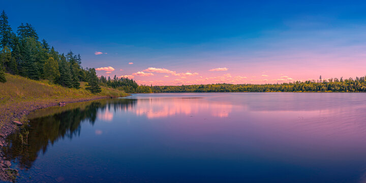 Colorful fantasy lake landscape and cloudscape over Town of Truro Reservoir at Victoria Park in Truro, Nova Scotia, Canada