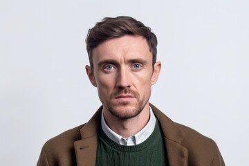 Fototapeta premium Medium shot portrait photography of a man in his 30s appearing weakened and pale because of anemia wearing a chic cardigan against a white background 