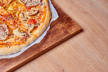 Home made, hot and organic Italian pizza on table. Mamma mia.