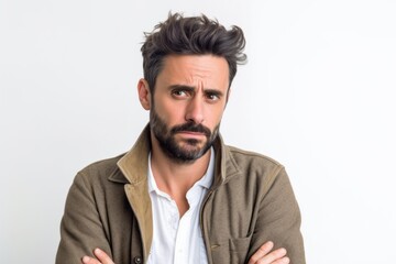 Fototapeta premium Lifestyle portrait photography of a man in his 30s with a pained and tired expression due to fibromyalgia wearing a chic cardigan against a white background 