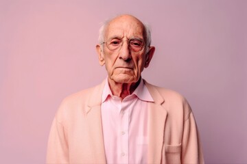 Obraz premium Medium shot portrait photography of a man in his 80s with a pained and tired expression due to fibromyalgia wearing a chic cardigan against a pastel or soft colors background 