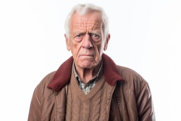 Group portrait photography of a man in his 80s appearing tired and down due to hypothyroidism wearing a chic cardigan against a white background 