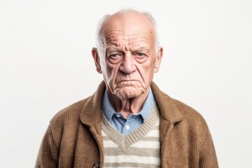 Group portrait photography of a man in his 80s appearing tired and down due to hypothyroidism wearing a chic cardigan against a white background 